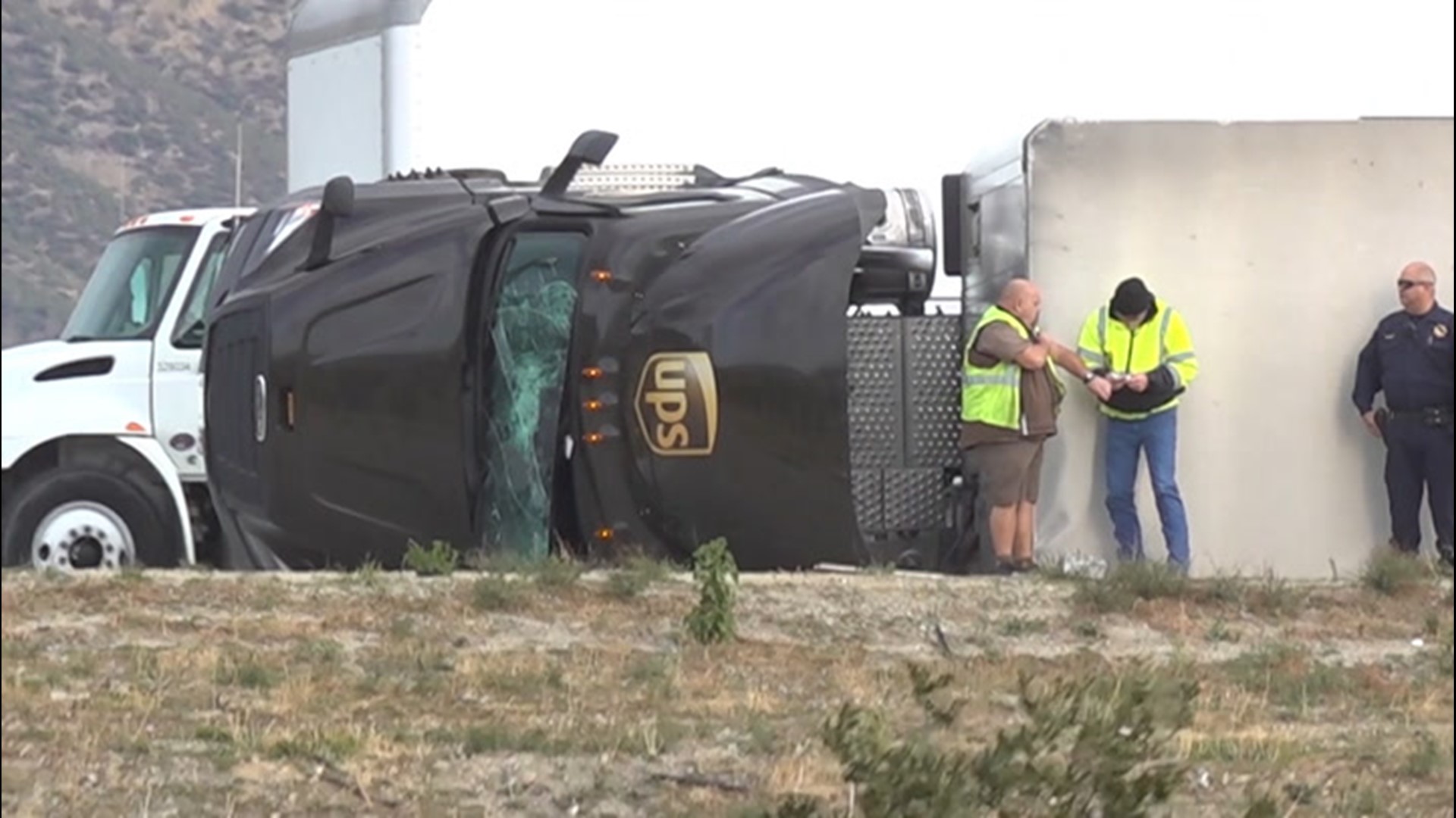 Strong winds are likely to blame for this 18-wheeler truck blown onto its side on a ramp connecting I-15 and I-210 in Fontana, California.