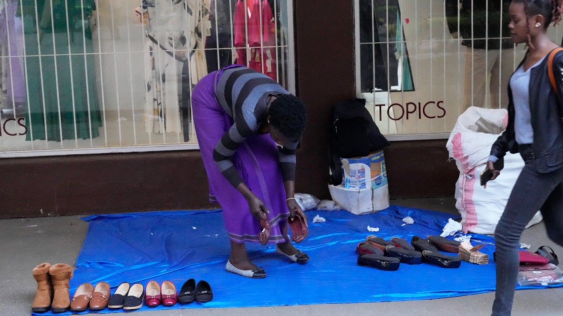 Zimbabwe's currency crumbles, street traders flourish