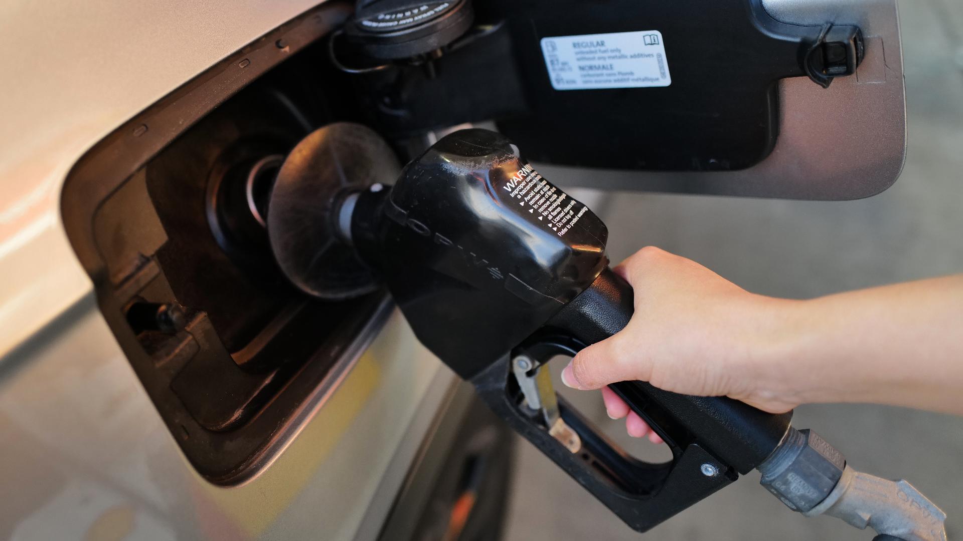 Oil prices fall sharply and Wall Street rallies toward a record as