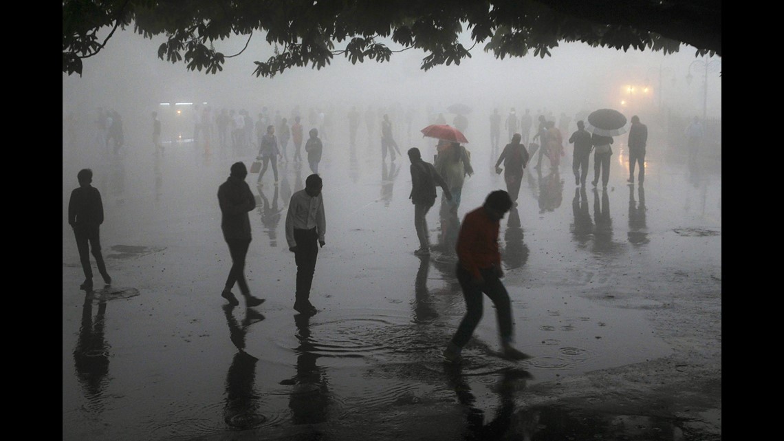 At least 91 dead after powerful rain and dust storms lash 