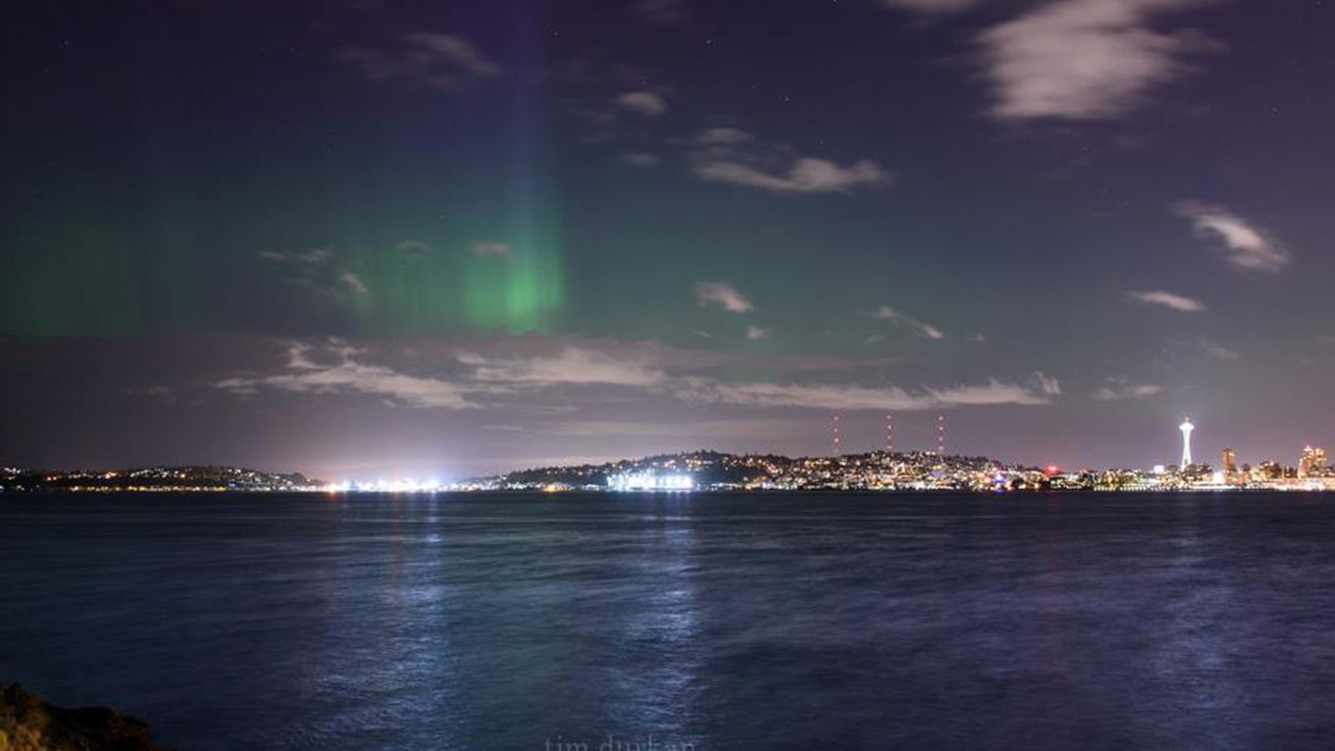 Awesome Aurora Northern Lights dance above Seattle skyline