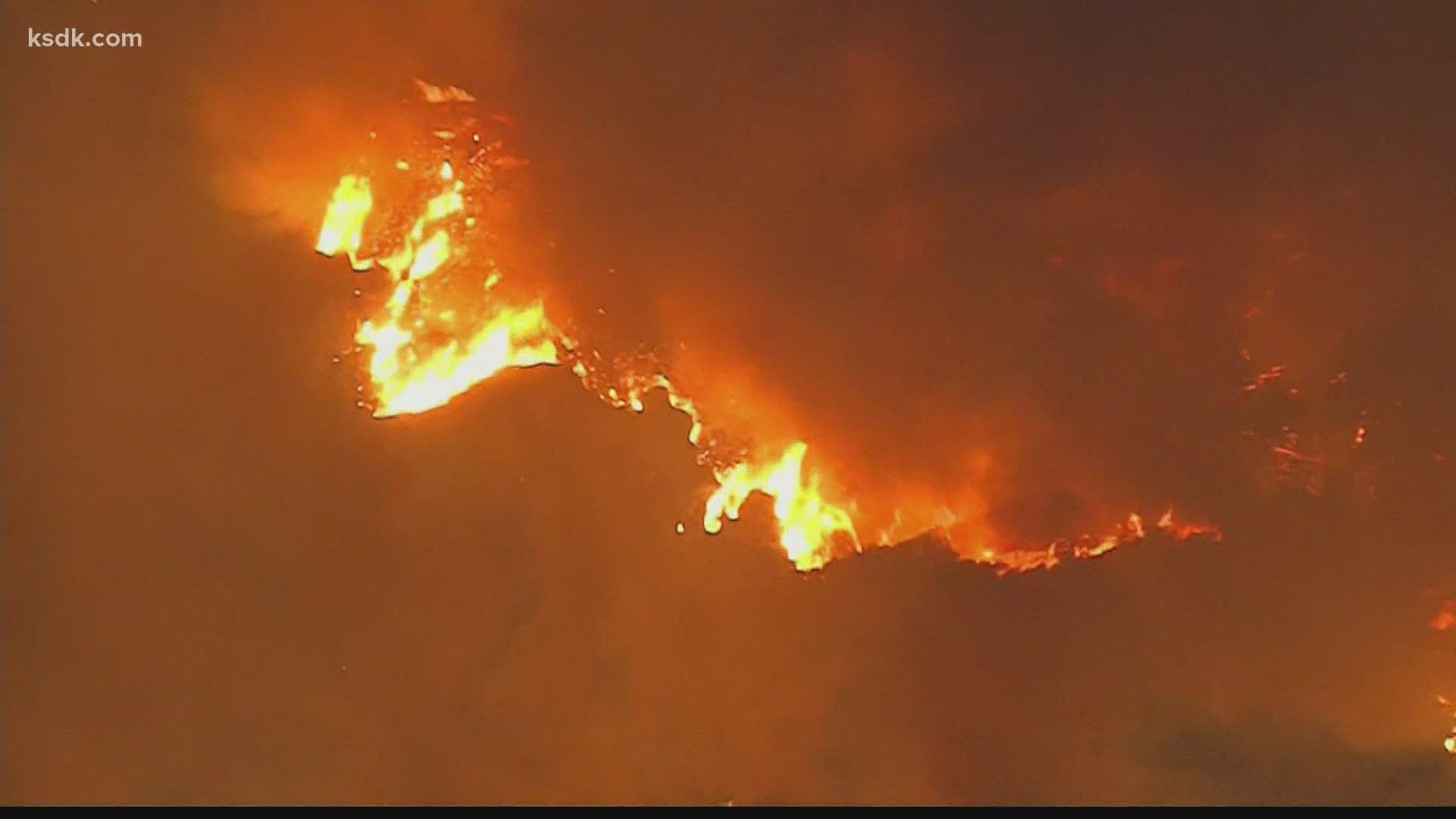 The El Dorado fire started on Saturday by what Cal Fire says was a "smoke generating pyrotechnic device"