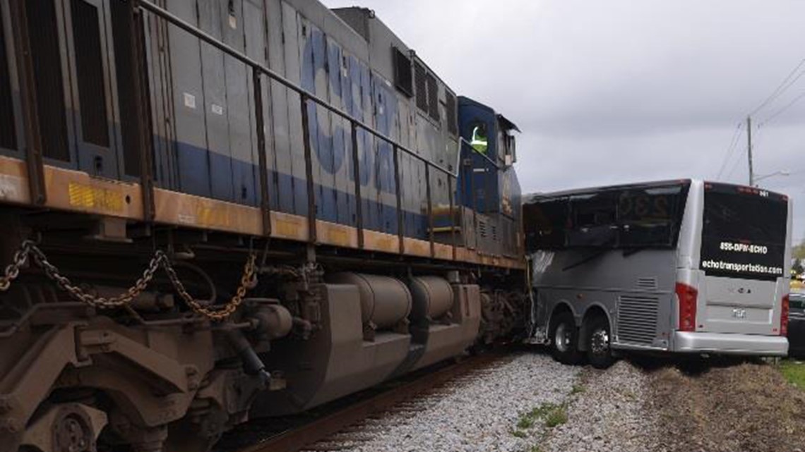 Fatal train collision with bus resulted from unsafe, humped road