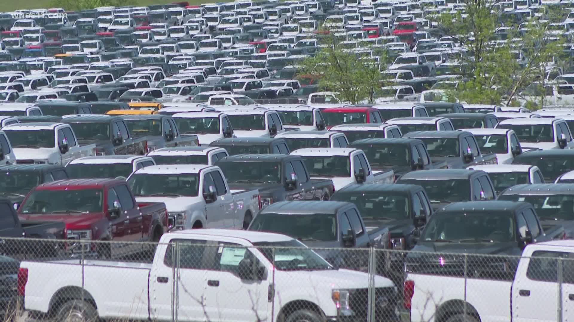 It's hard to miss hundreds of Ford trucks sitting idle at the Kentucky Speedway. Automakers across the globe are facing a major setback.