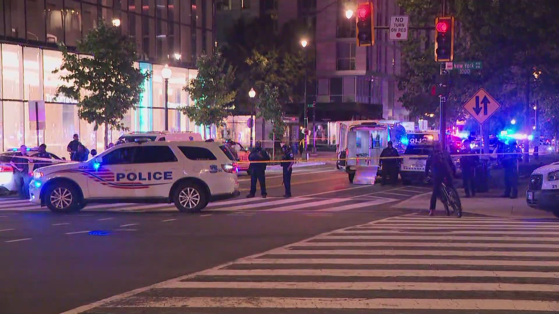 Video shows police in tactical gear running down the street.