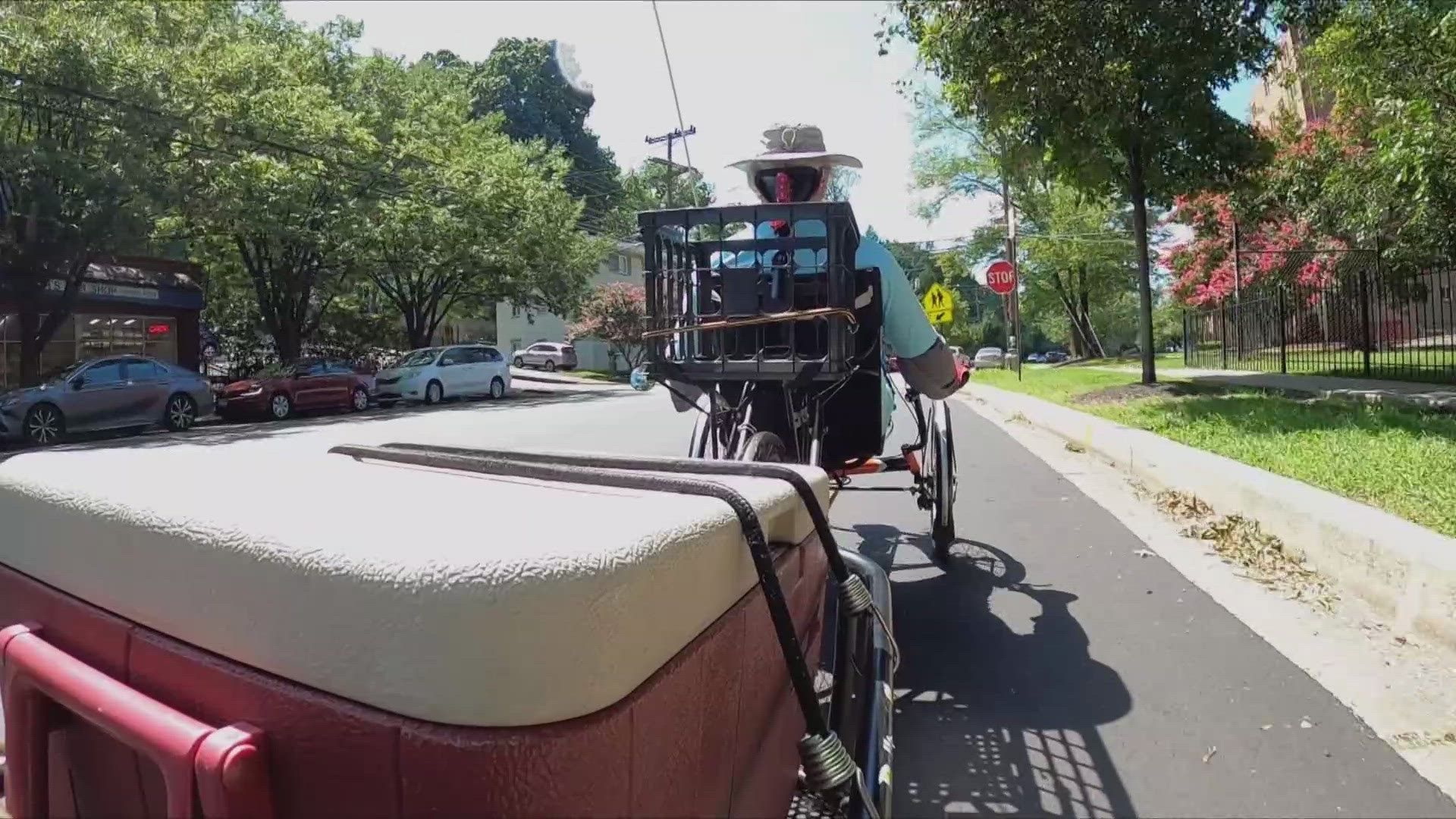 He uses his three-wheeled bike to deliver meals to those in need.