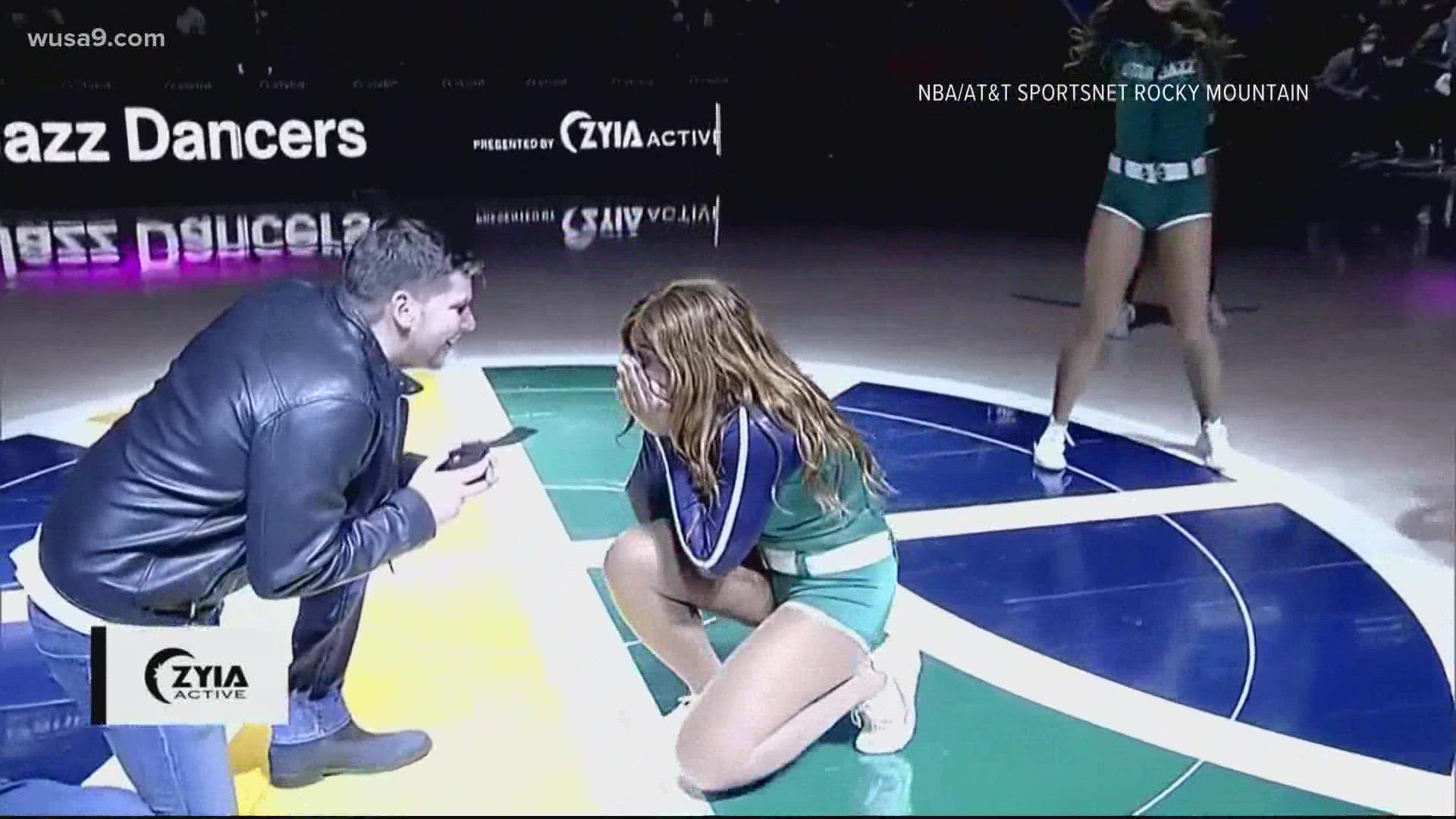 A jazz cheerleader in Utah was surprised with the sweetest wedding proposal during their routine.