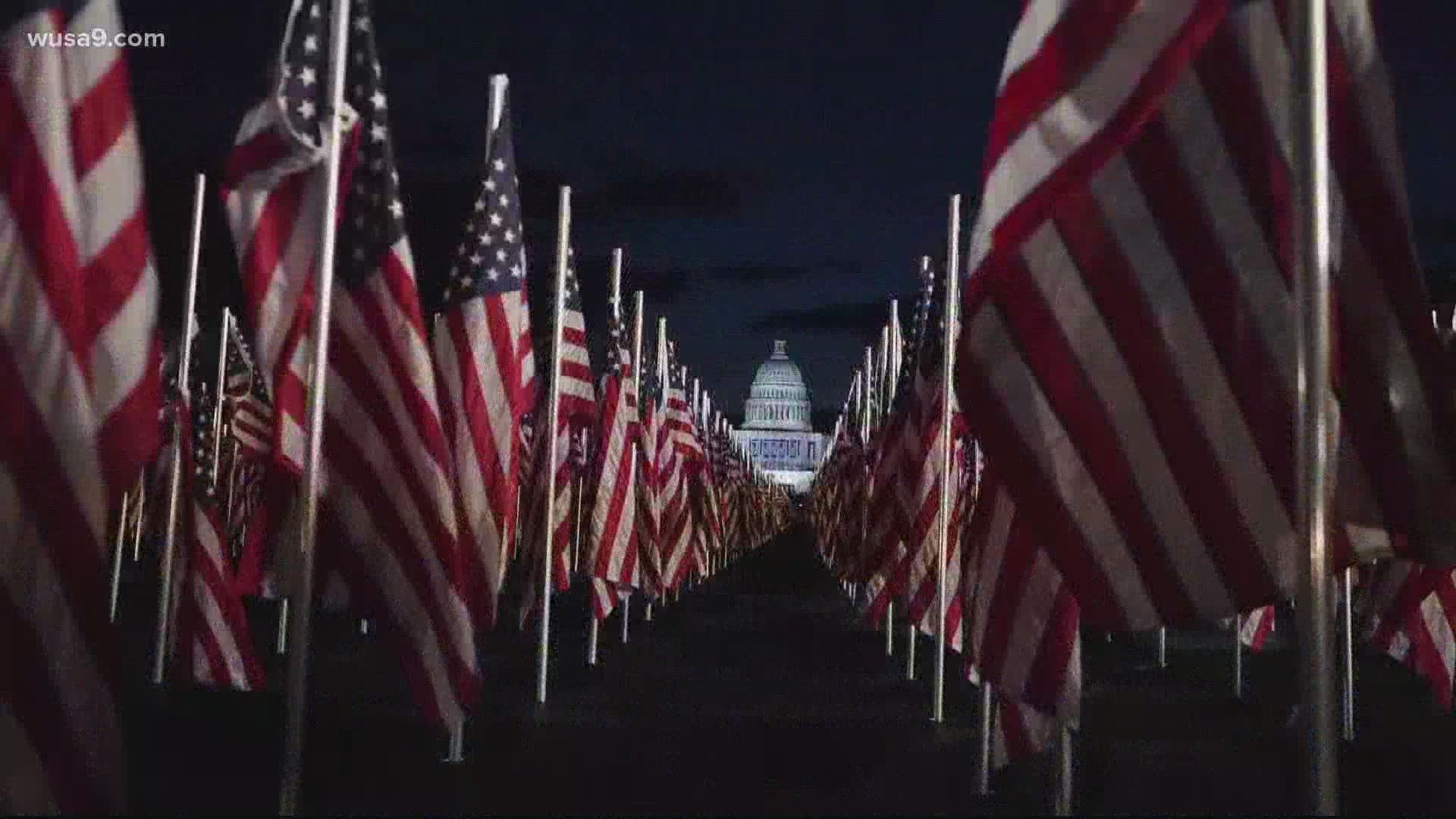 Police handed the flags that lined the National Mall on Inauguration Day out to passersby as a memento.