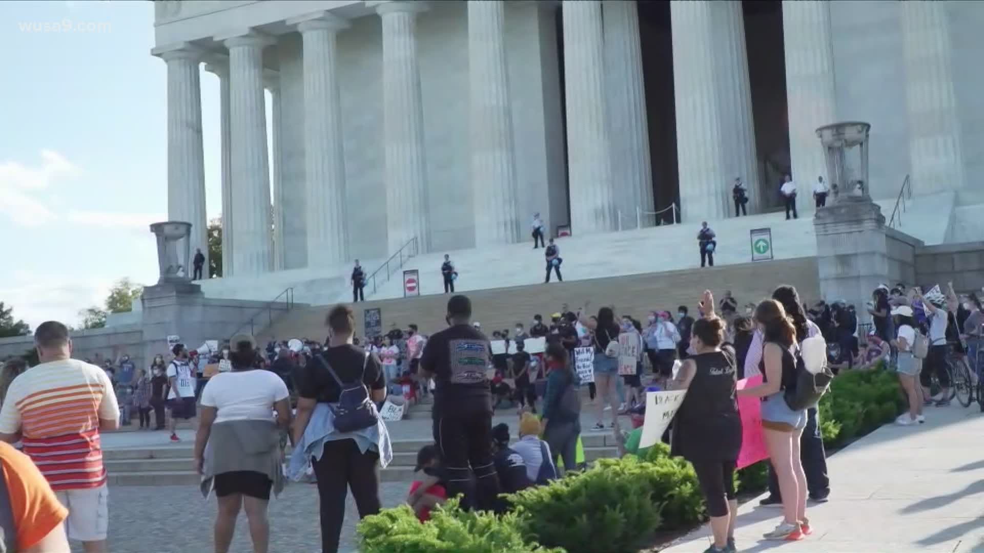 Nearly 200 demonstrators marched up the steps of the Lincoln Memorial calling for commonsense police reform.