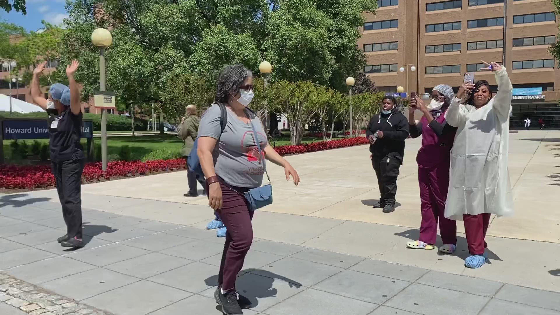 Howard University Hospital nurses cheer on protesters -- who applaud them right back.