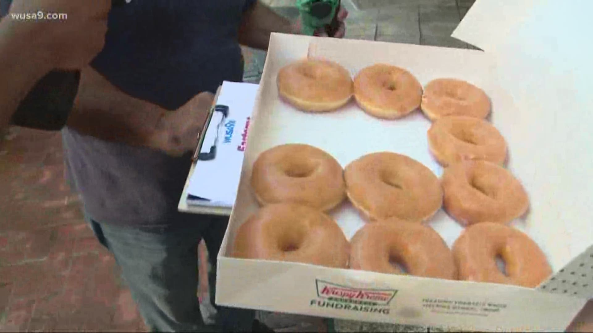We're here to make your day better. We are giving out doughnuts and dinero. Enjoy!
