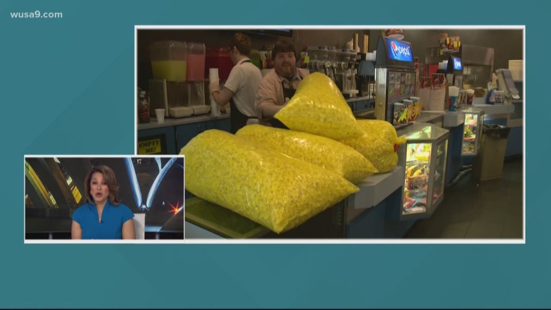 This theater owner can't sell movie tickets, so he's selling sidewalk popcorn instead.