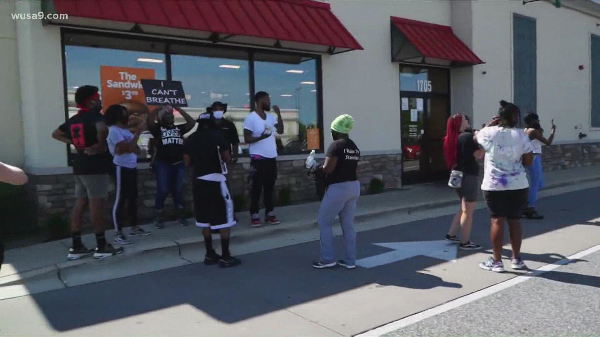 Protesters rally at Popeye’s over viral altercation between woman and security officer