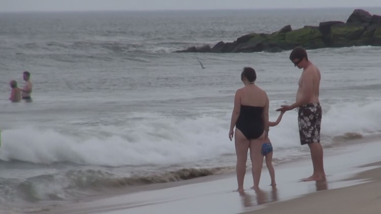 Woman pierced in chest by beach umbrella