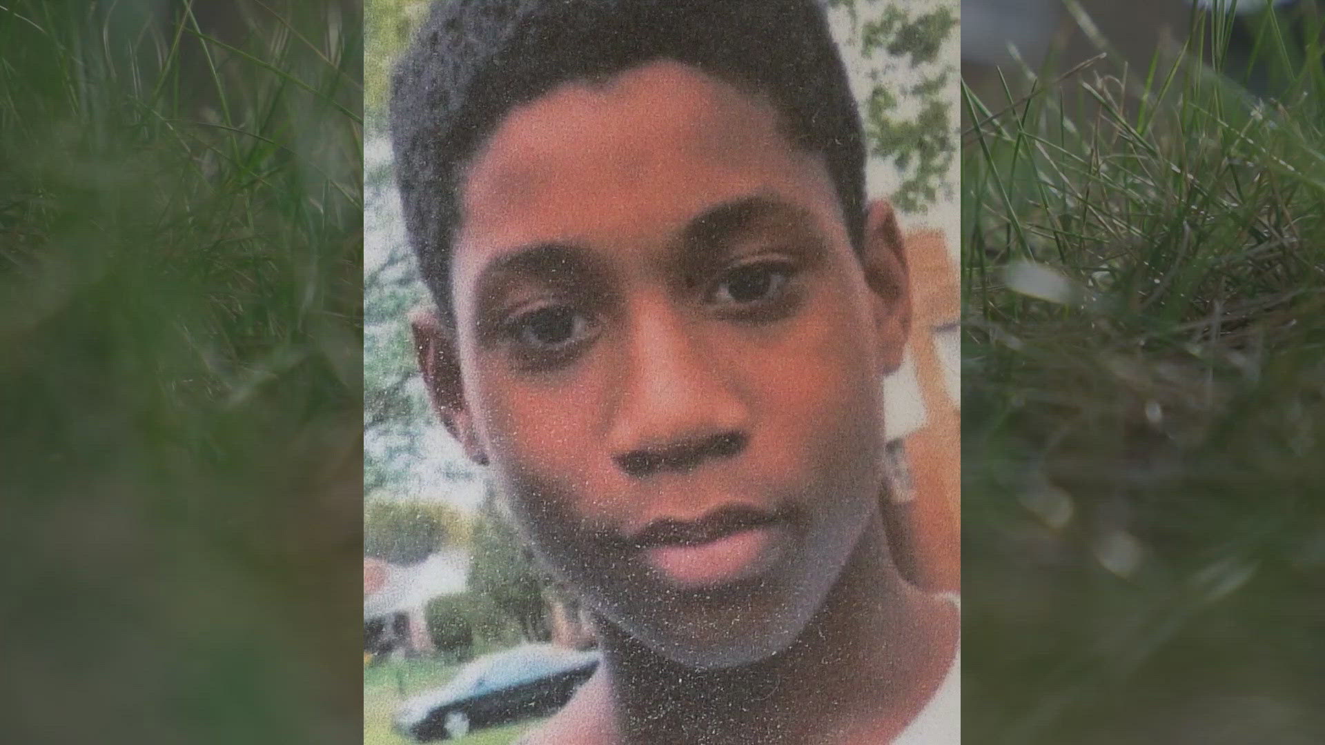 The boy was shot and killed while racking leaves in his front yard. 