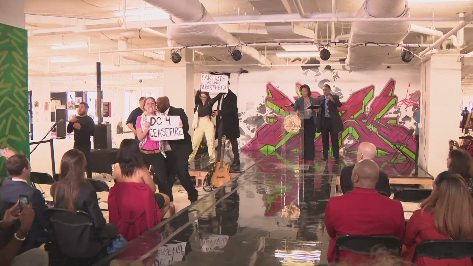 The protesters were calling for a ceasefire in Gaza. This happened when Mayor Bowser first approached the podium to speak at the Artomatic event.