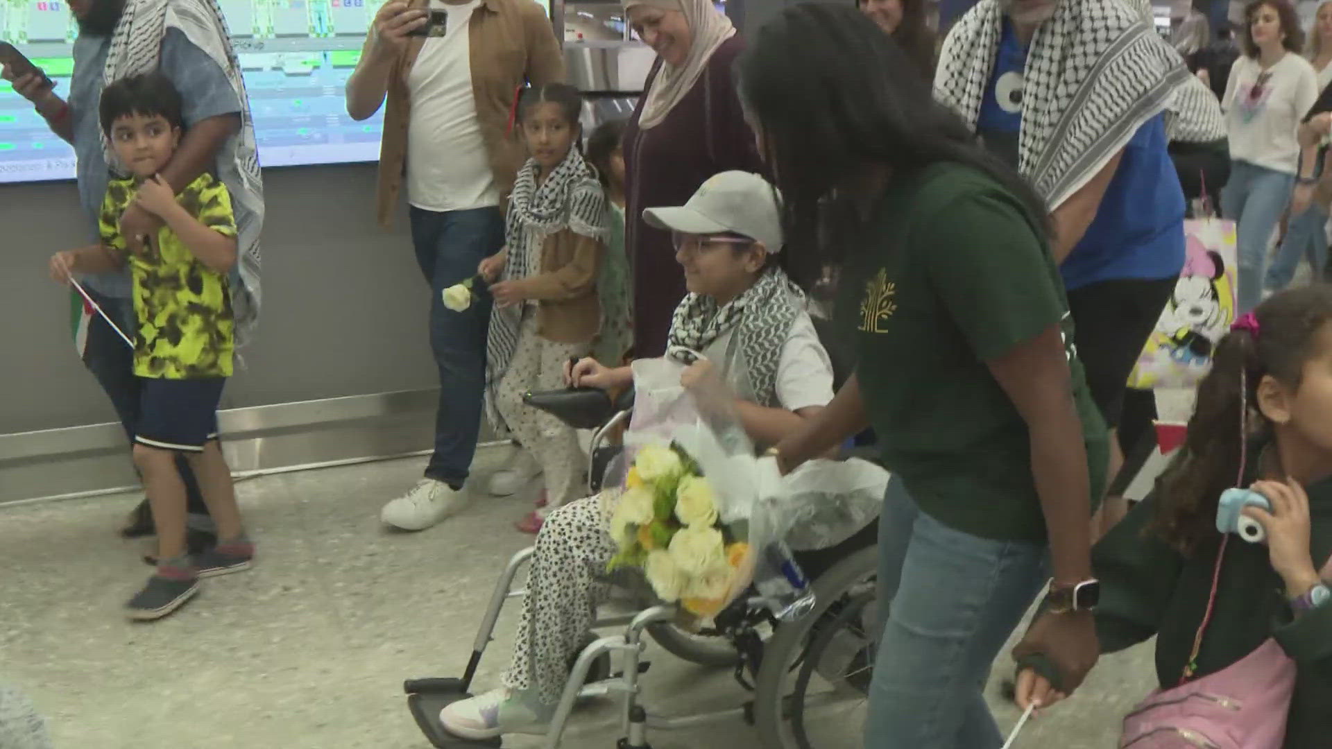 Hundreds gathered at Dulles International Airport to welcome Baylasan, who was injured in a bombing. She will receive a prosthetic leg through HEAL Palestine.