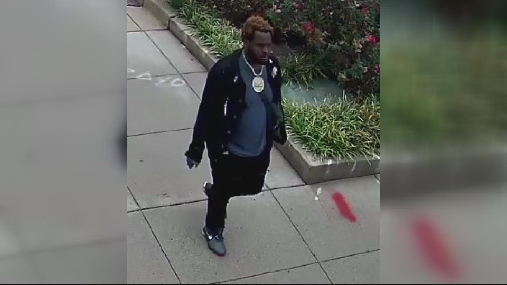 Police have released photos of a man they believe got out a gun and assaulted a woman at a Vienna hotel after he entered her unlocked room.
