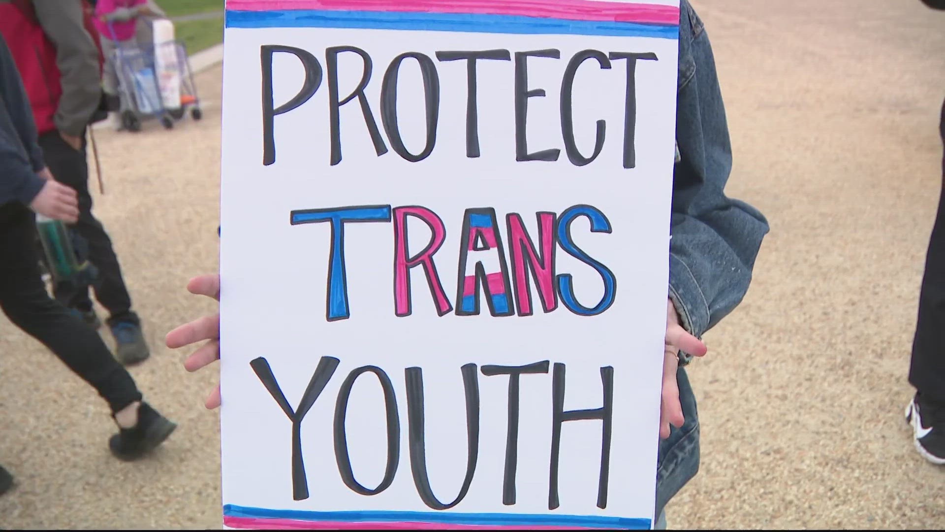 Activists called out anti-trans legislation during their march on Friday.