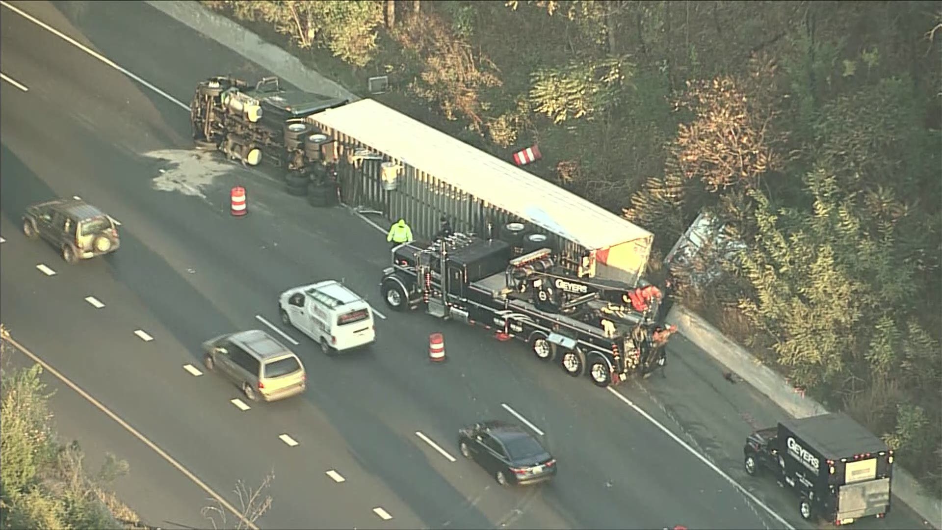 Crews are at the scene of an overturned tractor-trailer on the outer loop of I-495 near Rockville Pike.