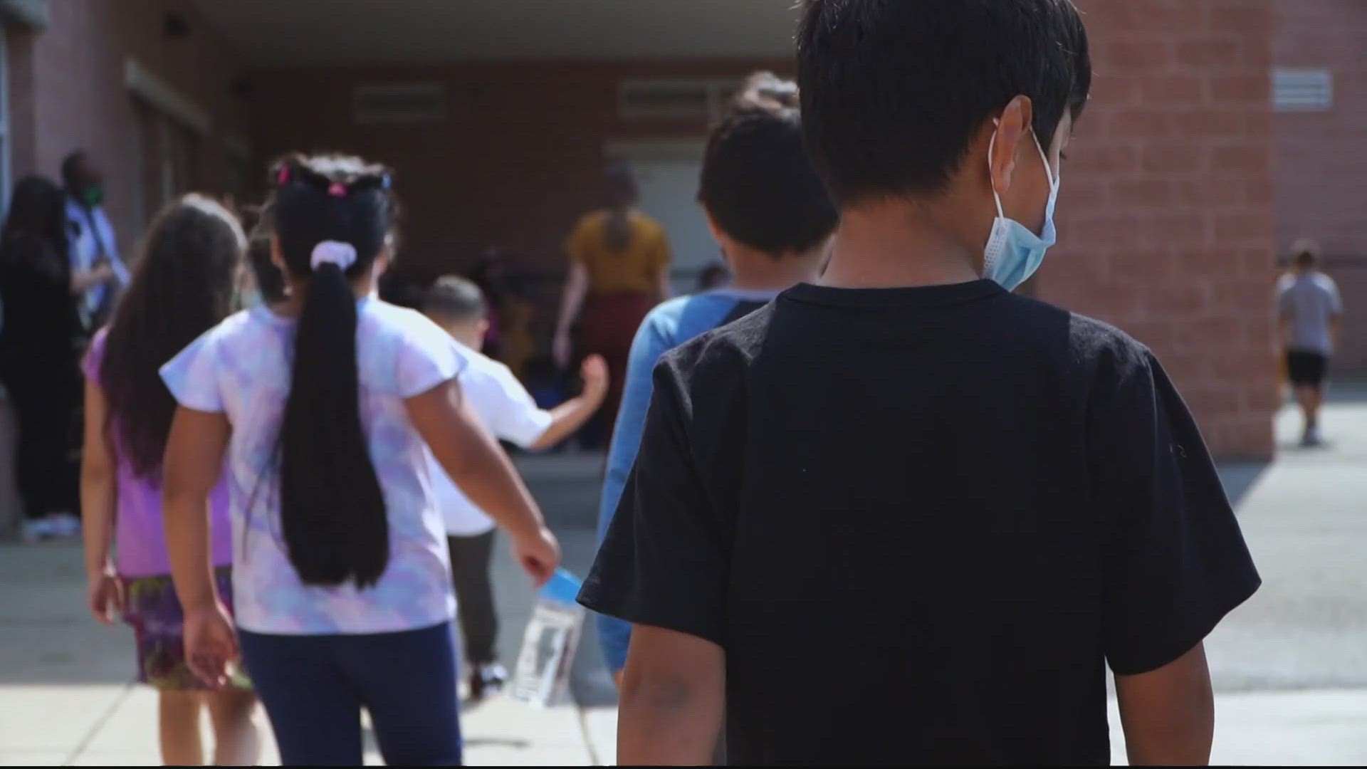 The students are required to wear masks for 10 days after at least three students tested positive.