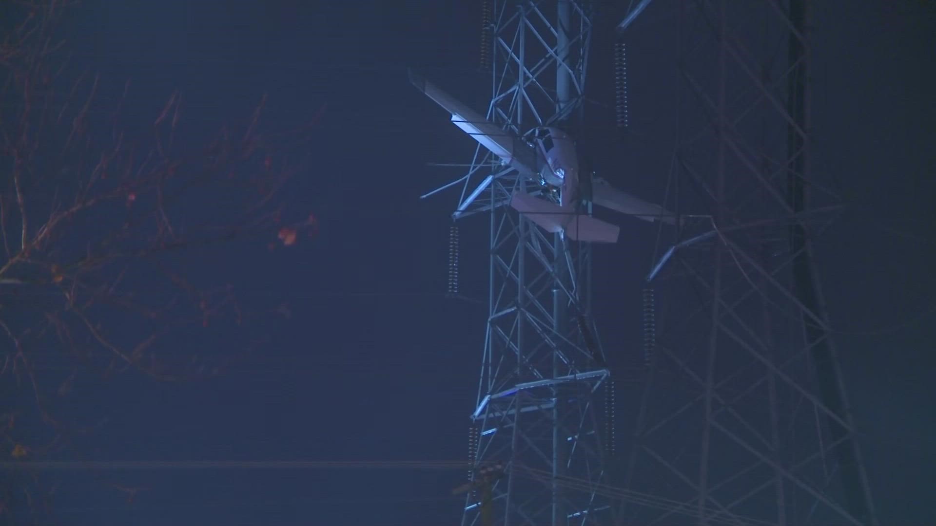 At the scene, the small plane was seen dangling 100 feet in the air in a Pepco tower.