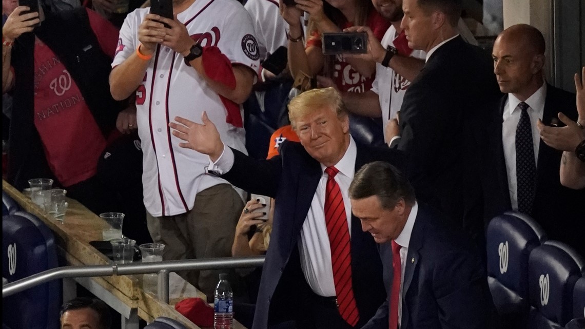 Trump grabs Washington Nationals catcher in bizarre embrace at White House, The Independent