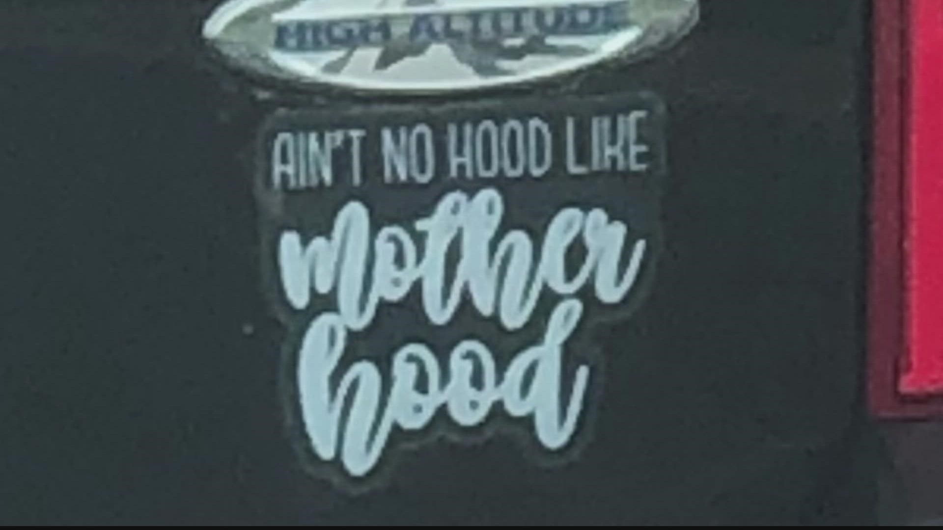 A person sends in a photo showing a bumper sticker that says "Ain't no hood like motherhood."