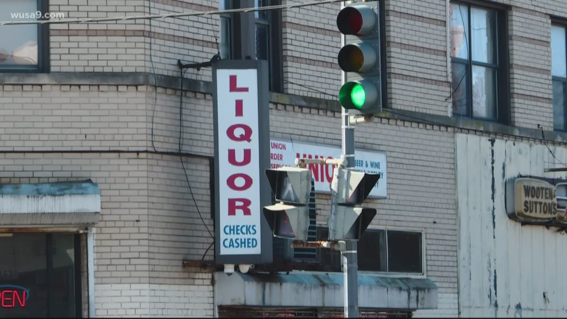 Police say a woman was shot standing outside of a liquor store and another one while sitting at a stoplight.