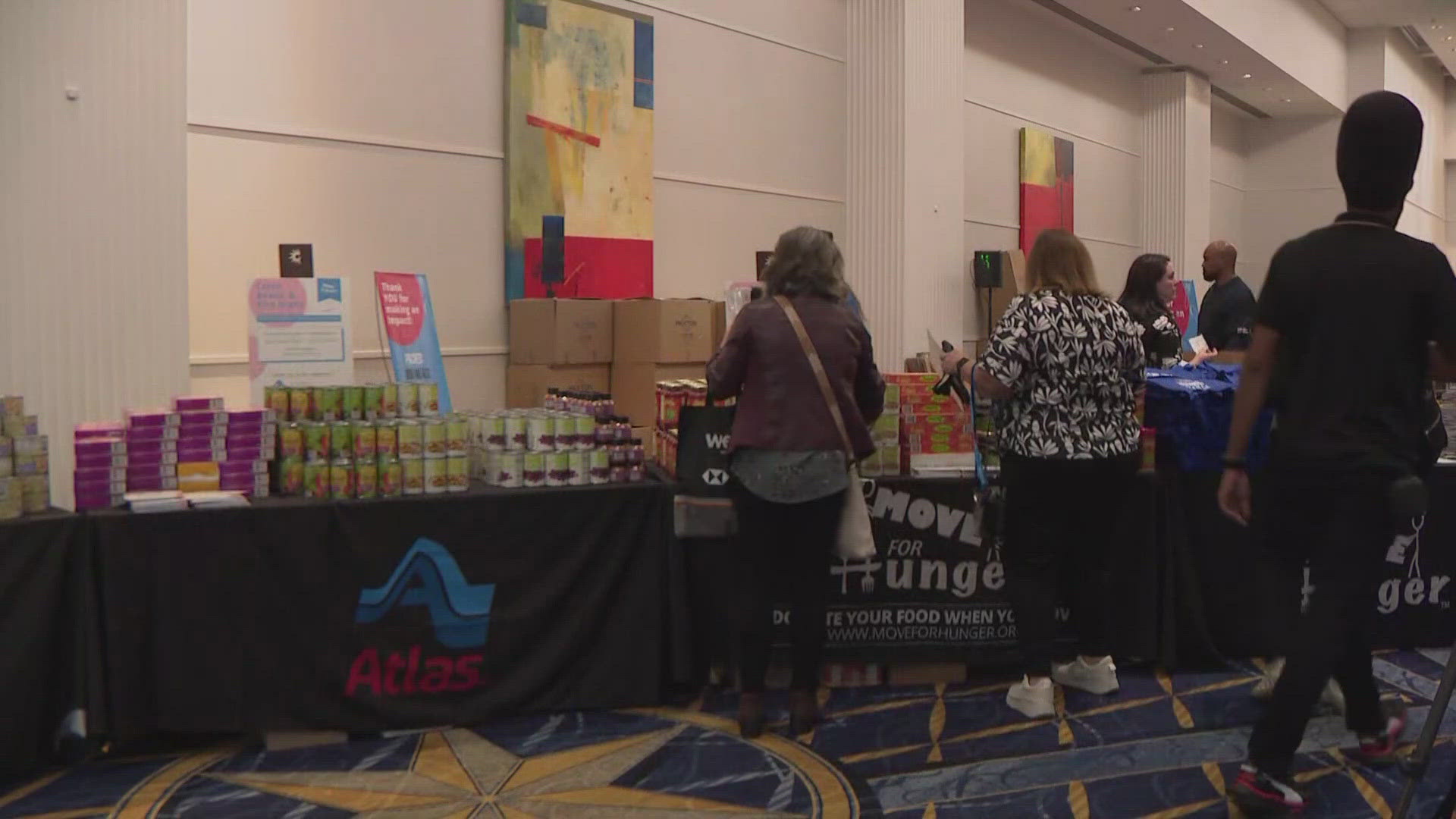 A DMV work development conference packed 900 meals for local Oxon Hill families.