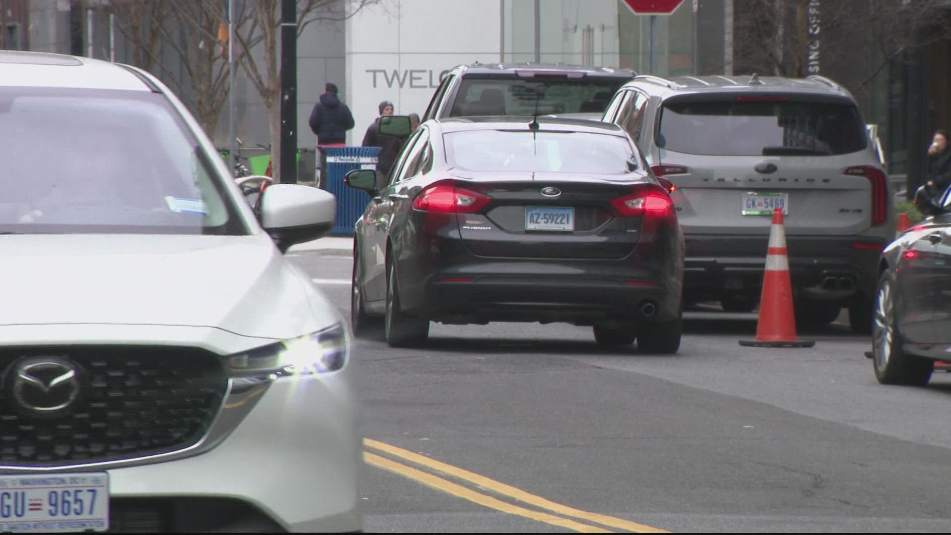 A man was carjacked after he was approached by a group of men with a weapon while he was sitting inside his vehicle at Navy Yard.