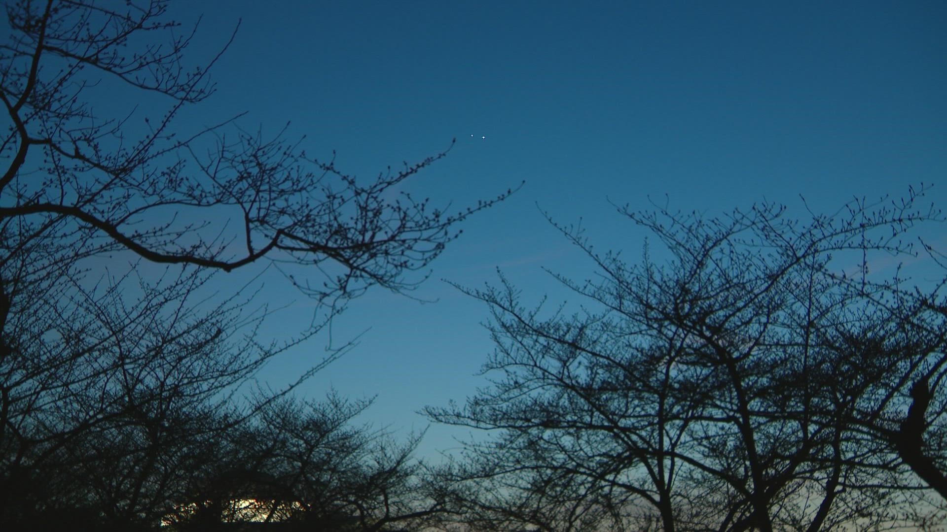 Venus and Jupiter shared a "cosmic kiss" in the night sky on Wednesday evening.