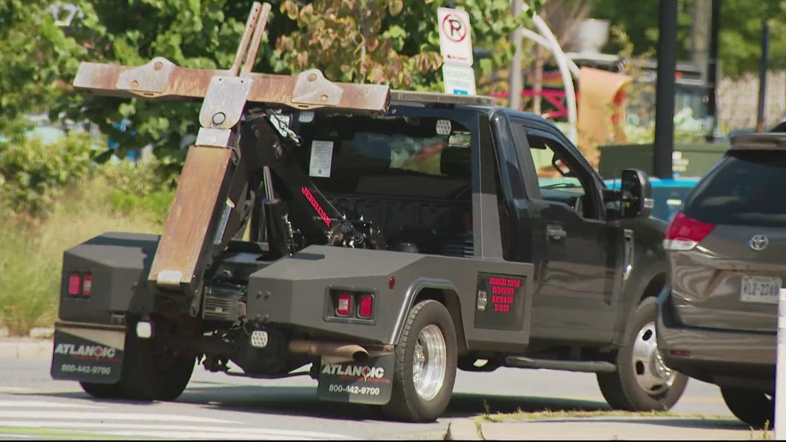 Tow truck driver hauls away SUV with children still inside | wusa9.com