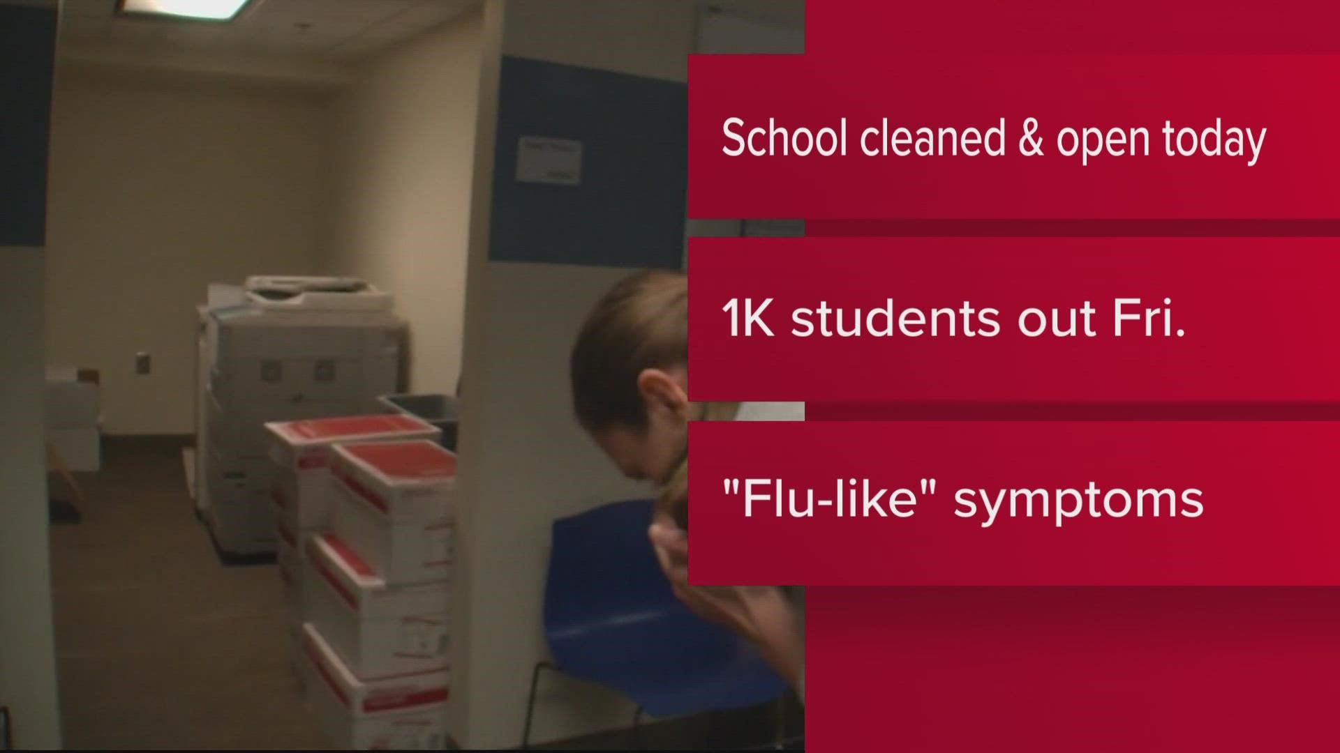 The school has been cleaned and disinfected after about 1,000 students were absent Friday with flu-like symptoms.