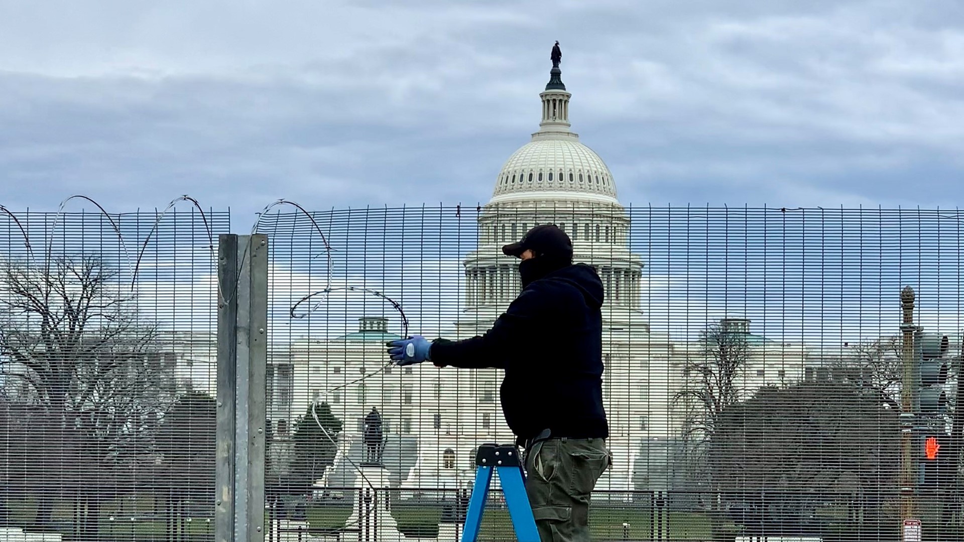 Crews removed barbed wire from some of the tallest fencing around the Capitol Monday. A fence will come down, but its razor wire will move to another barrier.