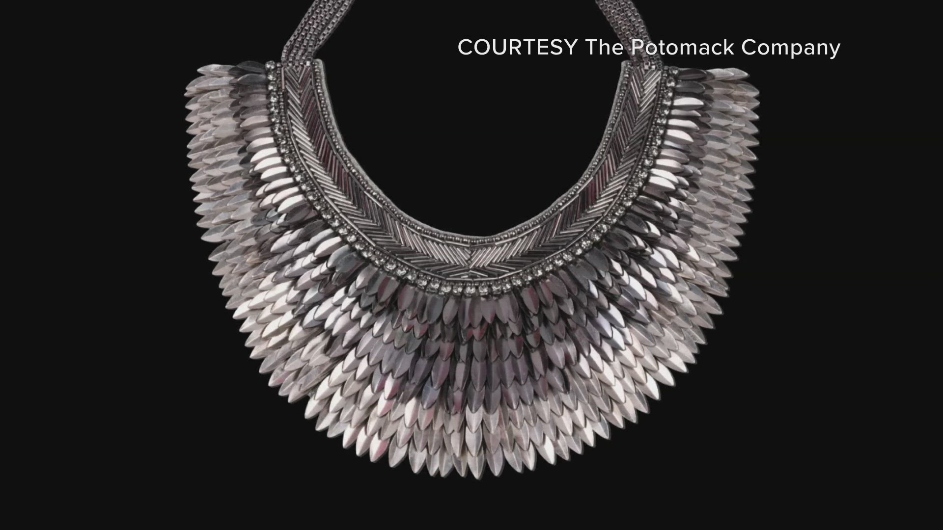 This collar is meant to evoke power and strength due to the imagery of battle armor in its layered metal pointed feathers.