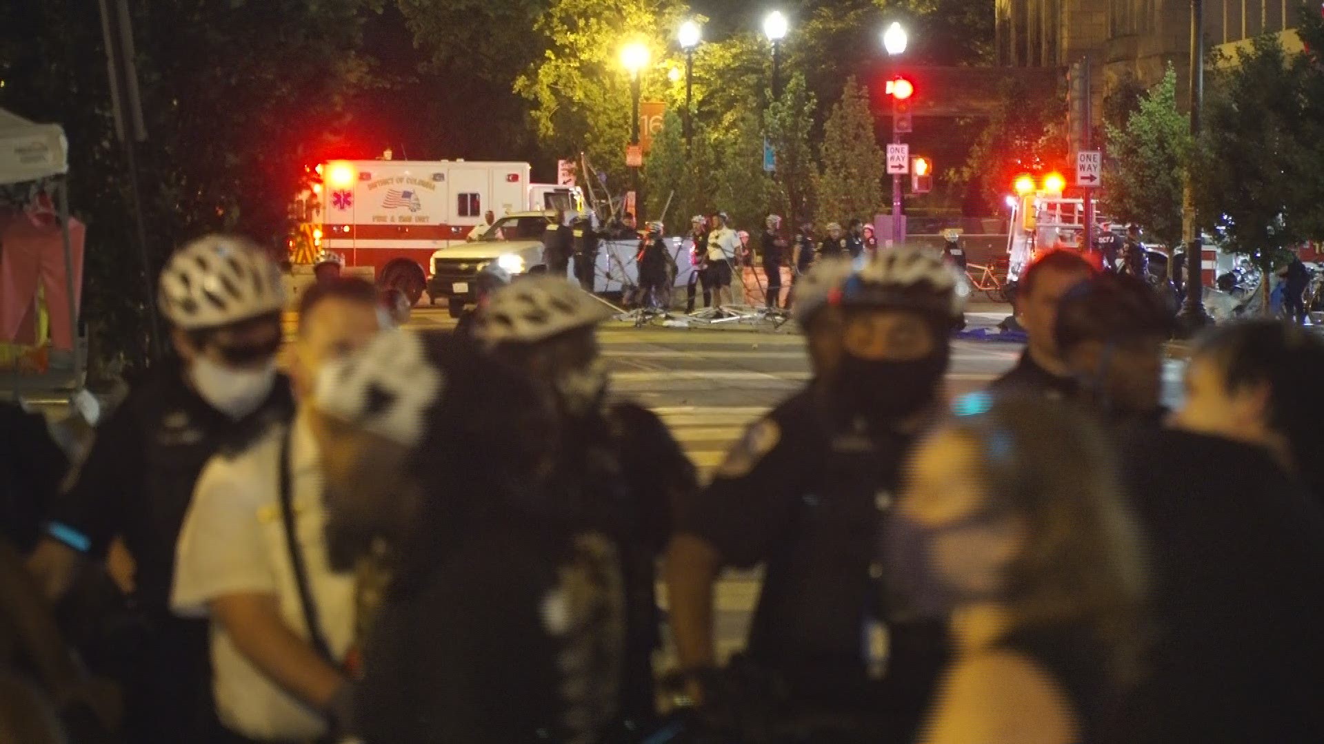 Police pushed protesters back from Black Lives Matter Plaza early Saturday morning, and removed some of the structures from along the street.