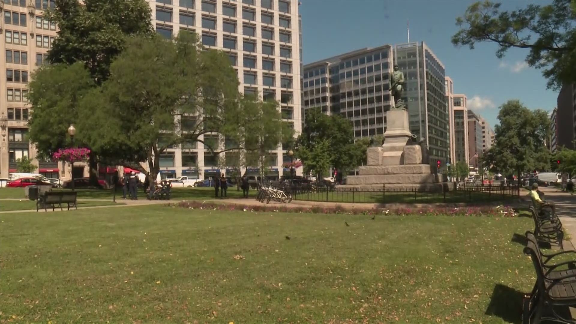 Officers on bikes are posted at the Farragut Square statue in D.C.