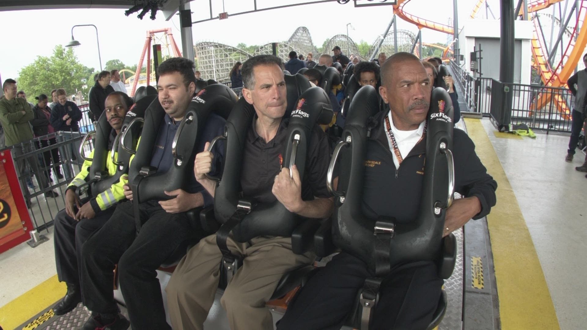 The fire and EMS teams rode the new Firebird Six Flags coaster.