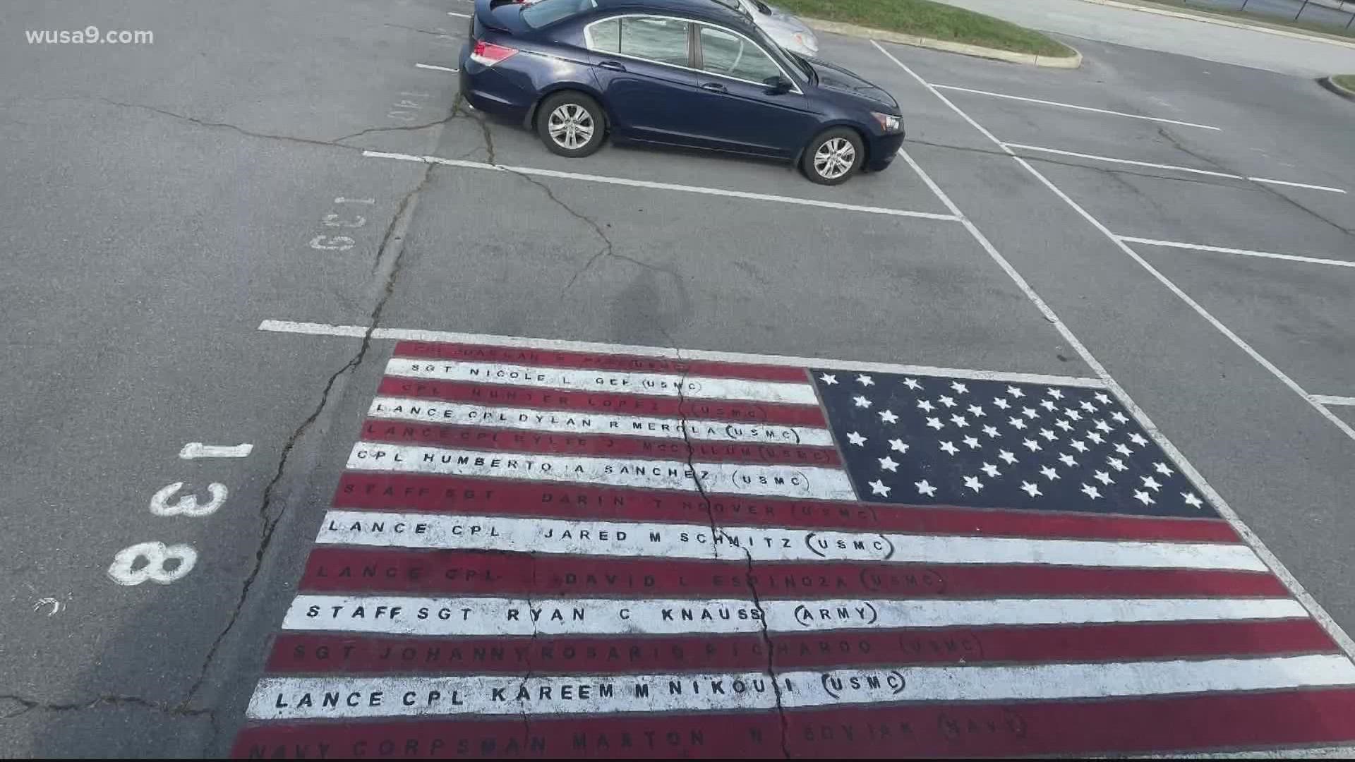 Kat Kibler chose to use her parking space to honor 13 U.S. soldiers killed in Afghanistan.