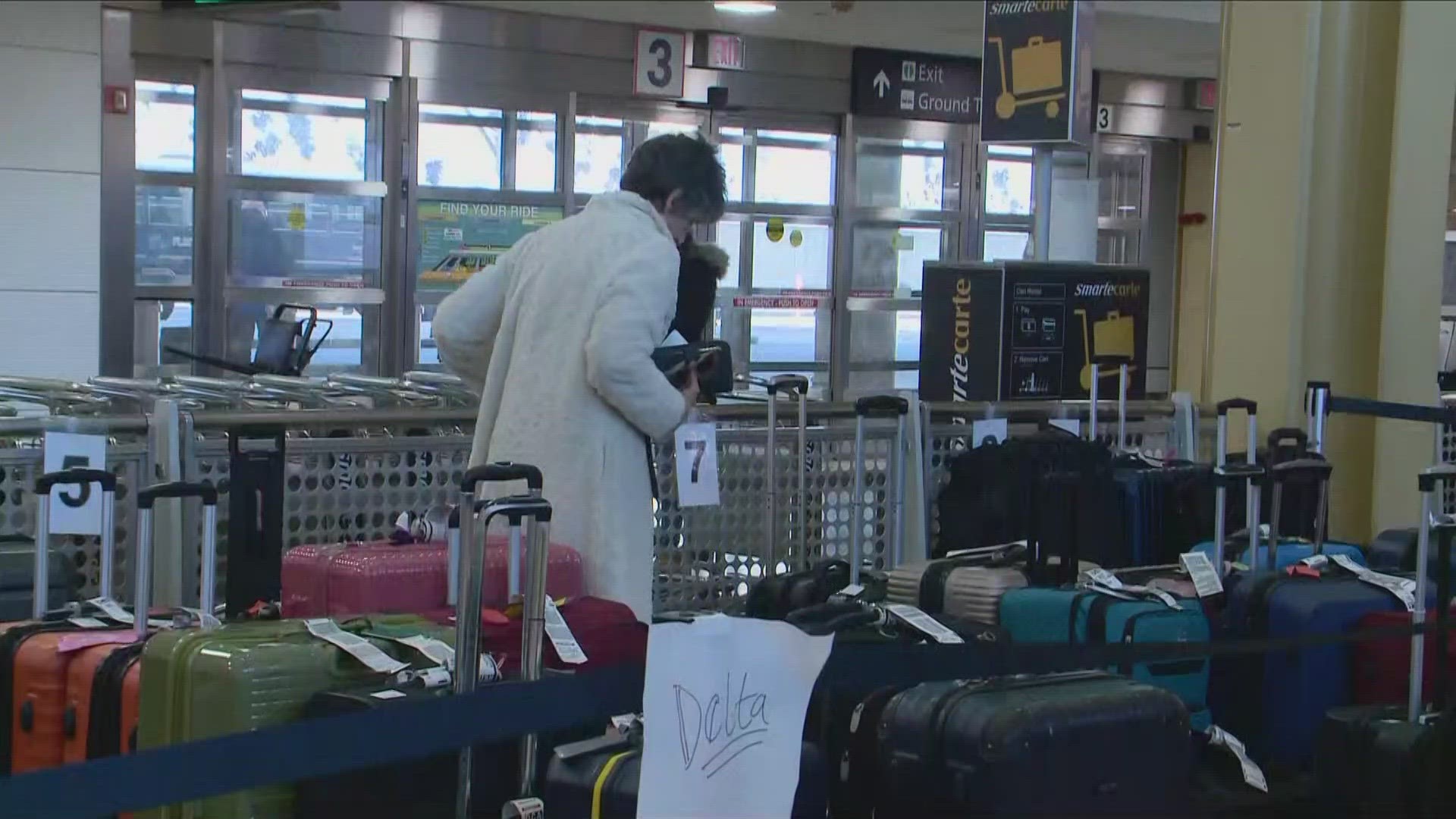 Two days after a storm forced flight delays and cancellations, more than 400 pieces of luggage still haven't been picked up from the airport.