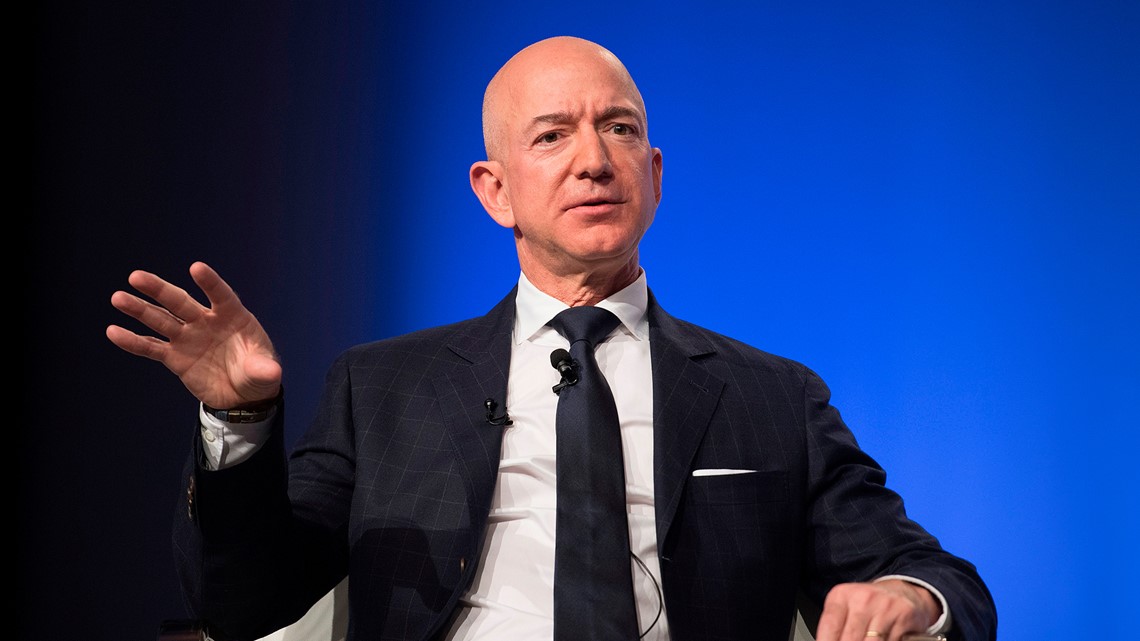 founder Jeff Bezos to join forces with hip-hop mogul in bid for  Commanders