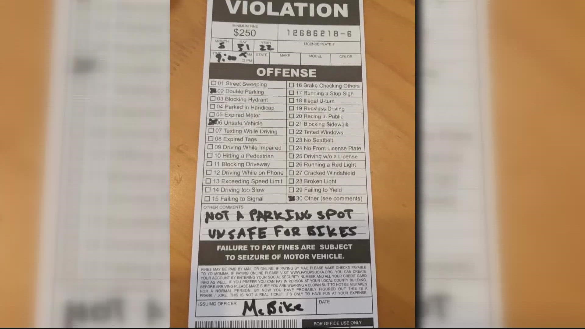 Mark Sussman bought fake parking tickets he found online and placed them on cars illegally parking in the pedestrian activation space.