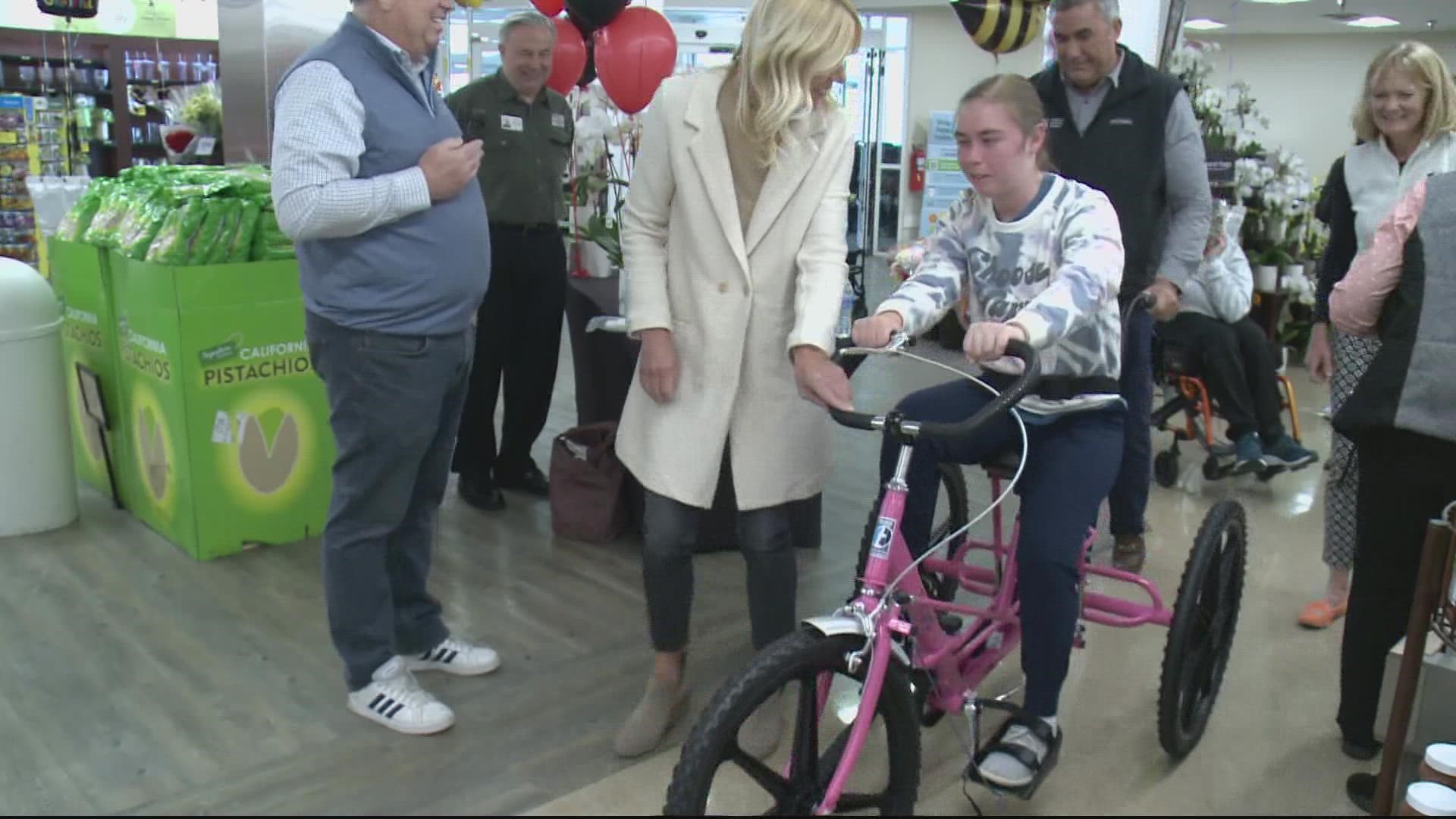 The girl's mom says she's excited her daughter can ride a bike like everybody else.