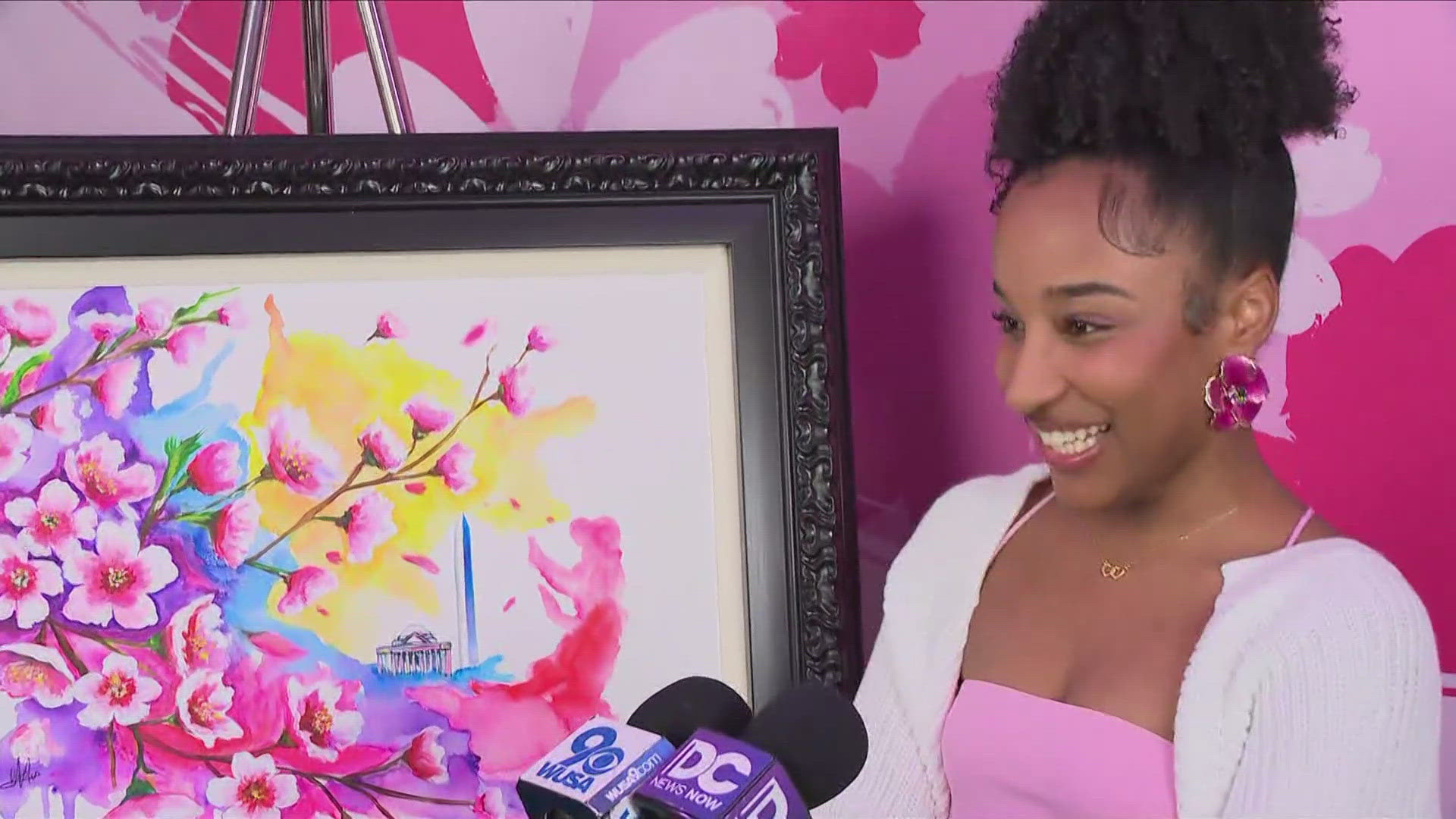 Wearing cherry-blossom earrings young artist Anna August was ecstatic about showing off her creation.