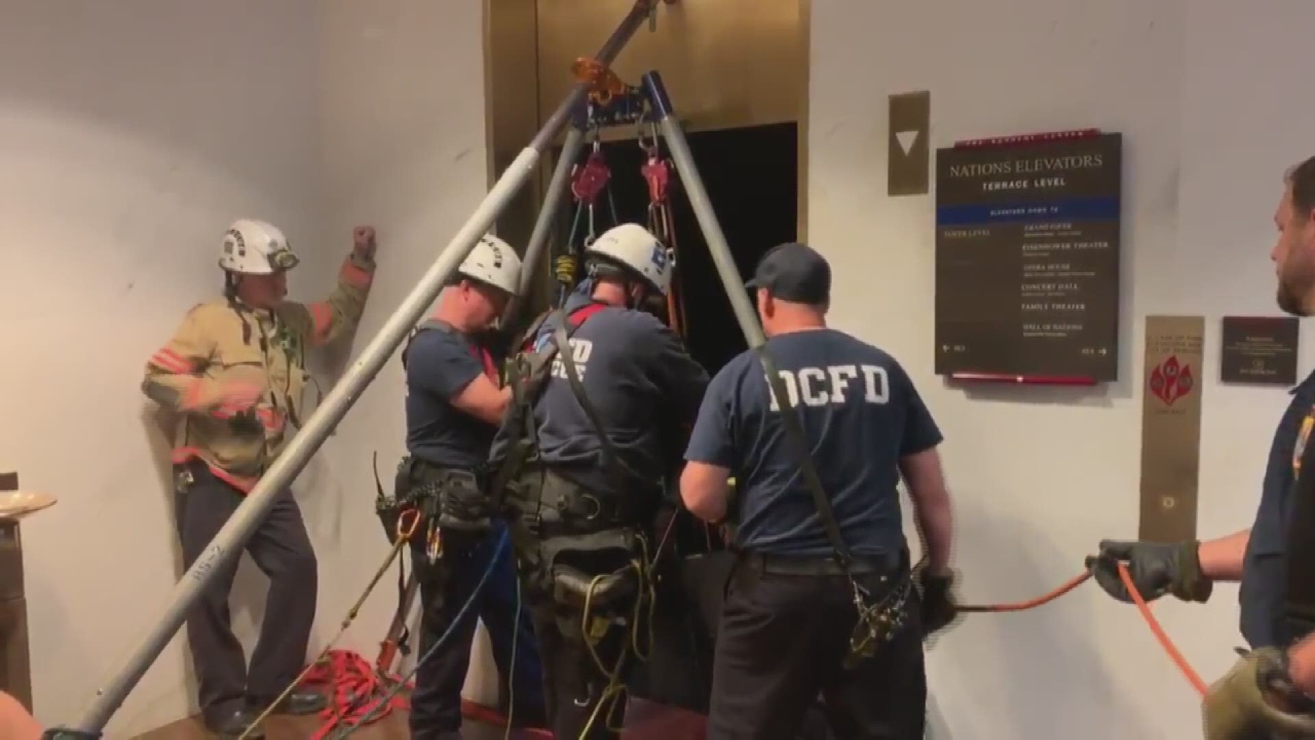 Three young adult visitors to the Kennedy Center had to be rescued from an elevator Tuesday night after it malfunctioned.