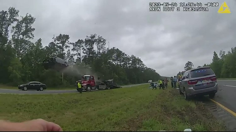 Car goes airborne 120ft  after speeding off tow truck ramp in Georgia