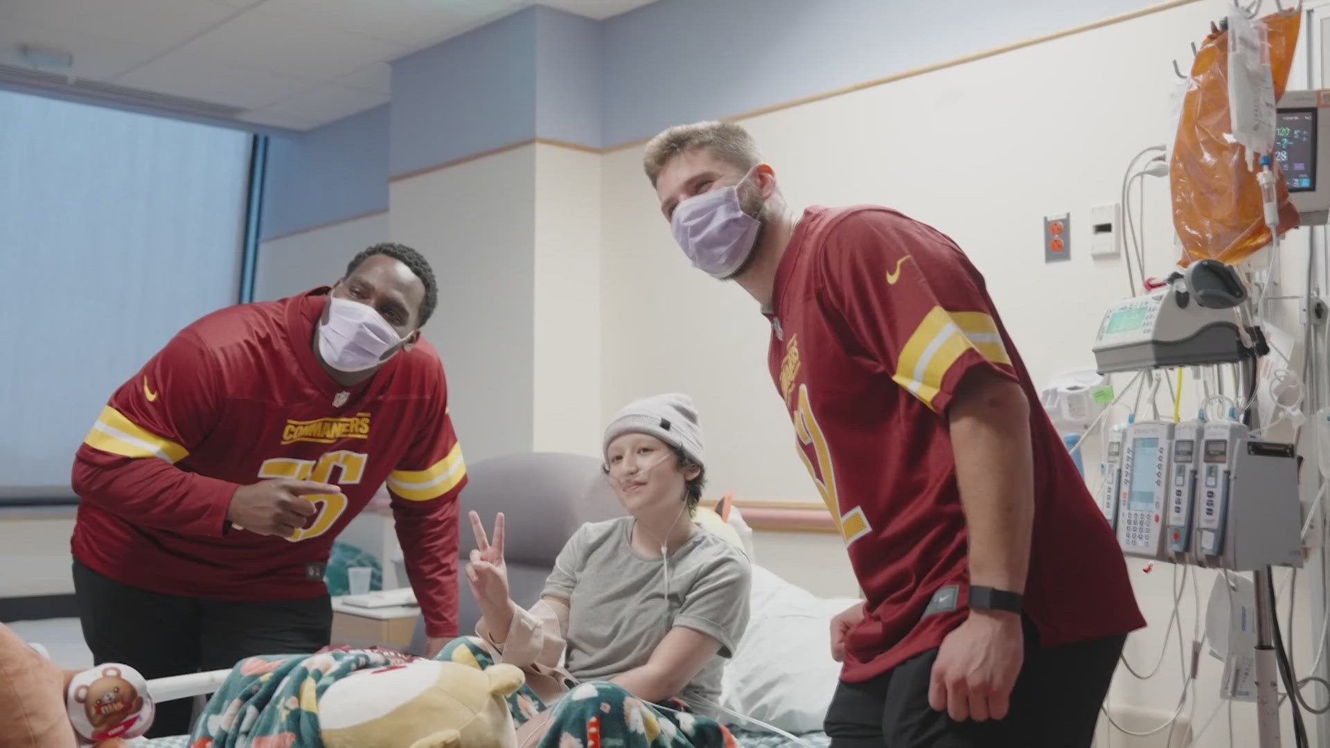 Players Ben Sinnott, Chris Paul, Brandon Coleman and Colson Yankoff visited the hospital to help launch their "Crucial Catch" program to detect cancer early.