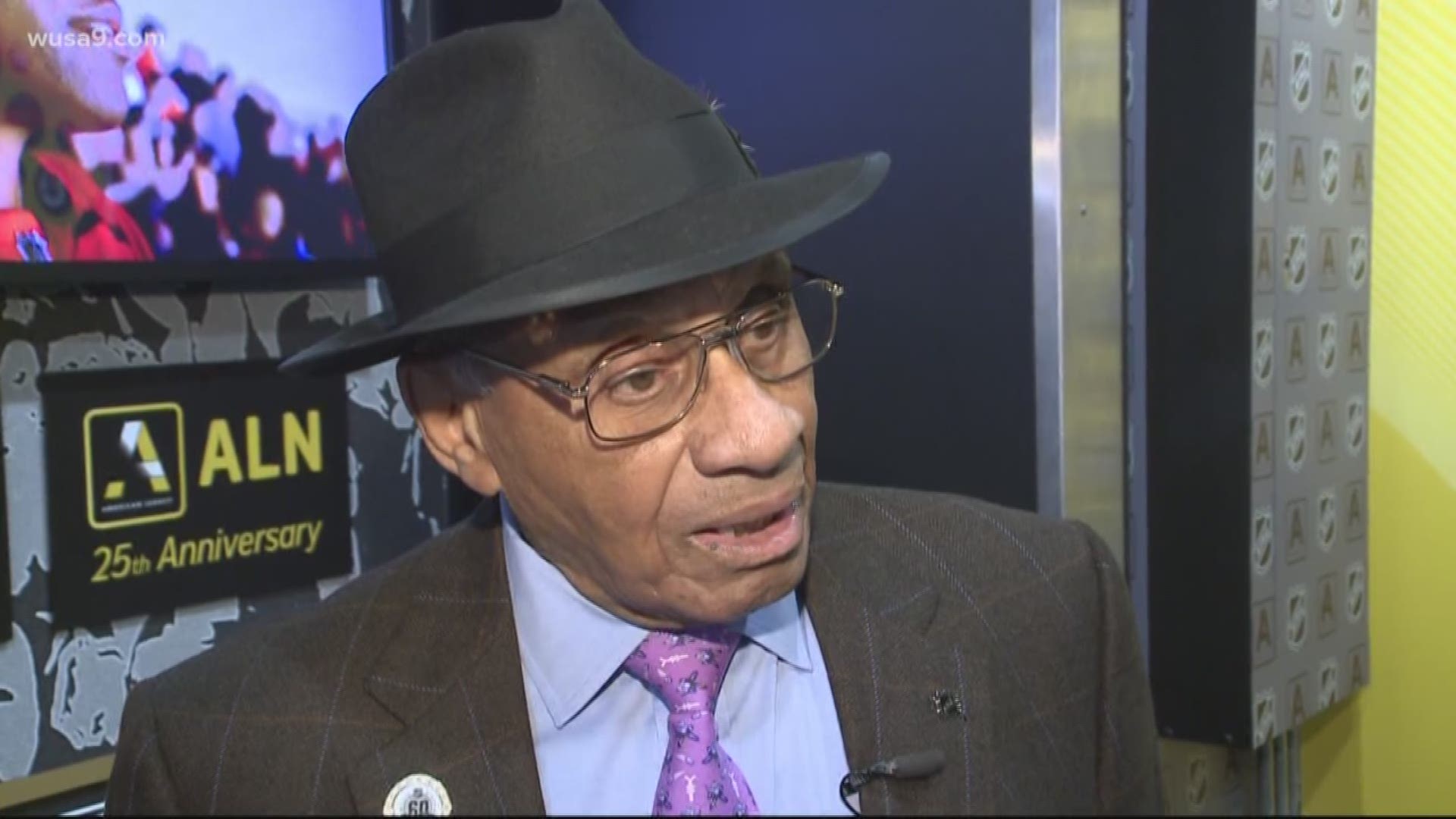 We talk with Willie O'ree, the NHL's first black hockey player, at the league's mobile museum celebrating black hockey history.
