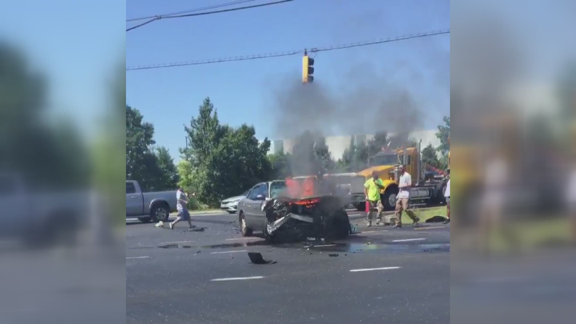 A person was saved from a burning car after a crash on Suitland Parkway in Prince George's County, Maryland. Bystanders can be seen pulling someone out of the car.